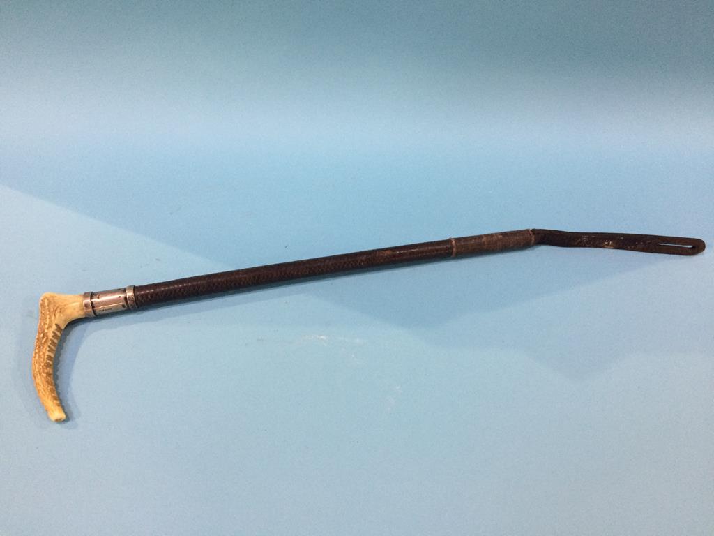 A silver mounted riding crop