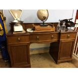 An Edwardian bow front pedestal sideboard