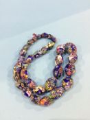 A string of colourful millefiori beads