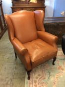 A Laura Ashley tan leather armchair