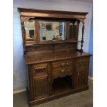 An oak mirror backed sideboard