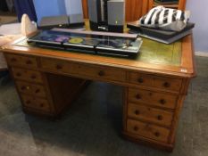 A Victorian oak pedestal Partners desk, with inset green leather top, 152cm wide, 154cm deep