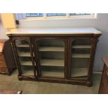 A Victorian marble top walnut three door side cabinet, the white marble top below three glazed