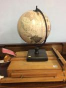 An easel and a globe