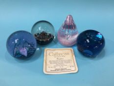 Four Caithness paperweights