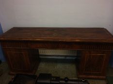 A 19th century mahogany sideboard with lift up top, having heavy brass supports and fold away shelf,