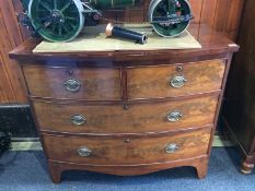 A Georgian mahogany bow front chest of drawers with two short and two long graduated drawers,