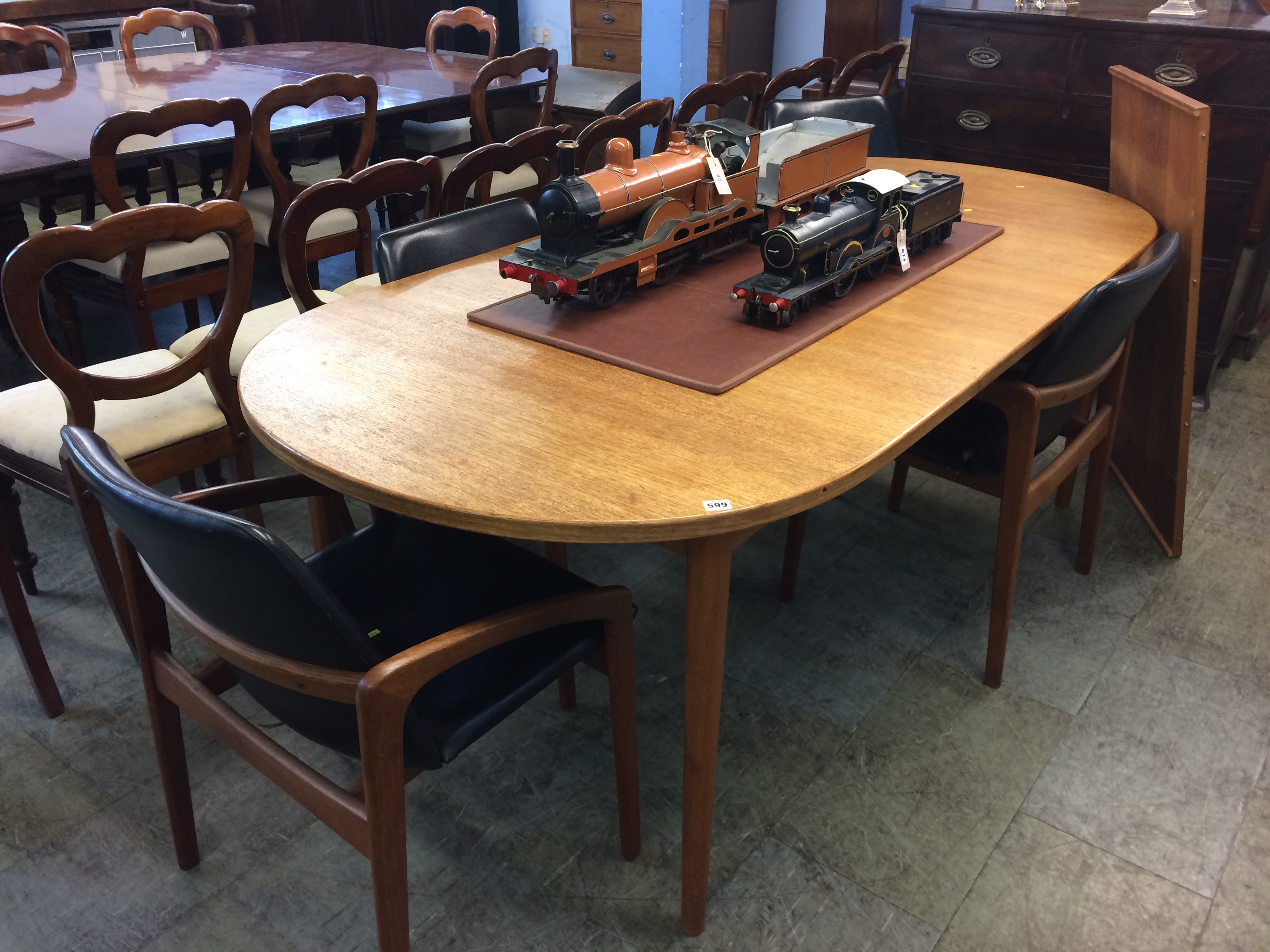 A set of six Kai Christensen style teak dining chairs, with black vinyl upholstered back and