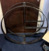 A bespoke made circular metal work kindling and log store. 90cm diameter
