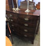 A Georgian mahogany bow front chest of drawers, with two short and three long graduated drawers,