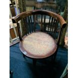 An Edwardian walnut tub chair