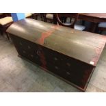 A large Continental pine domed top trunk, with two handles and decorated in green and reds. 142cm