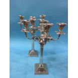 Pair of silver four branch candelabra, with Corinthian columns, the fluted and reeded columns