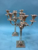 Pair of silver four branch candelabra, with Corinthian columns, the fluted and reeded columns