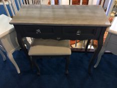 A modern grey side table and matching stool