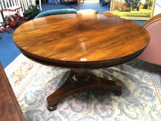 A 19th century circular rosewood breakfast table, supported on a trefoil base. 117cm diameter