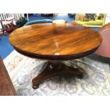 A 19th century circular rosewood breakfast table, supported on a trefoil base. 117cm diameter