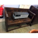 A small oak panelled settle. 122cm wide