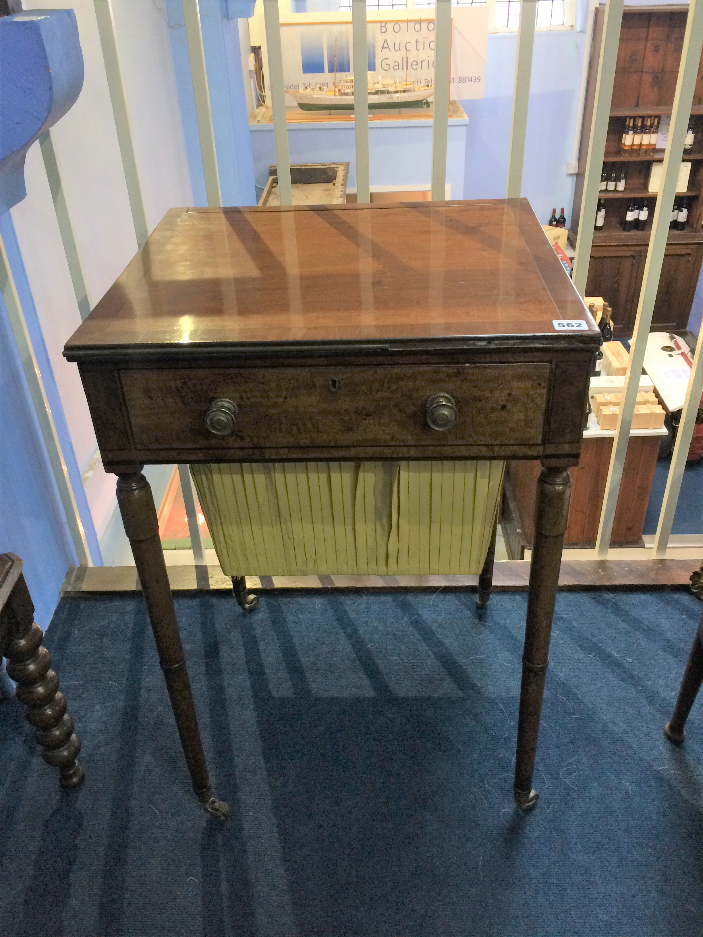 A 19th century mahogany work box, the rectangular top opening to reveal a writing slope and fitted