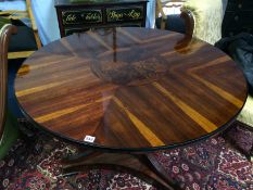 An Empire style rosewood circular centre table, with quarter top and parquetry centre and