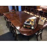 A 19th century mahogany extending dining table, with two extra leaves, supported on fluted and