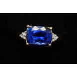 18ct gold ring set with large blue stone and diamo