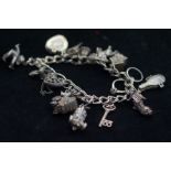 Silver charm bracelet 56.8 grams