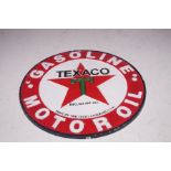 A Texaco gasoline motor oil cast iron sign, diamet