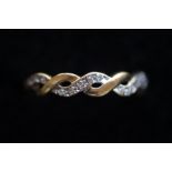 9ct Gold criss-cross ring set with diamonds