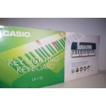 A Casio Lk-110 keyboard with lighting keys- boxed