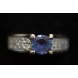 18ct white gold ring set with central blue stone a