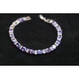 Silver bracelet with purple stones