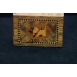 A marquetry box decorated with Scottish Terriers