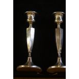 A pair of silver candle sticks- 20cm (bruised)