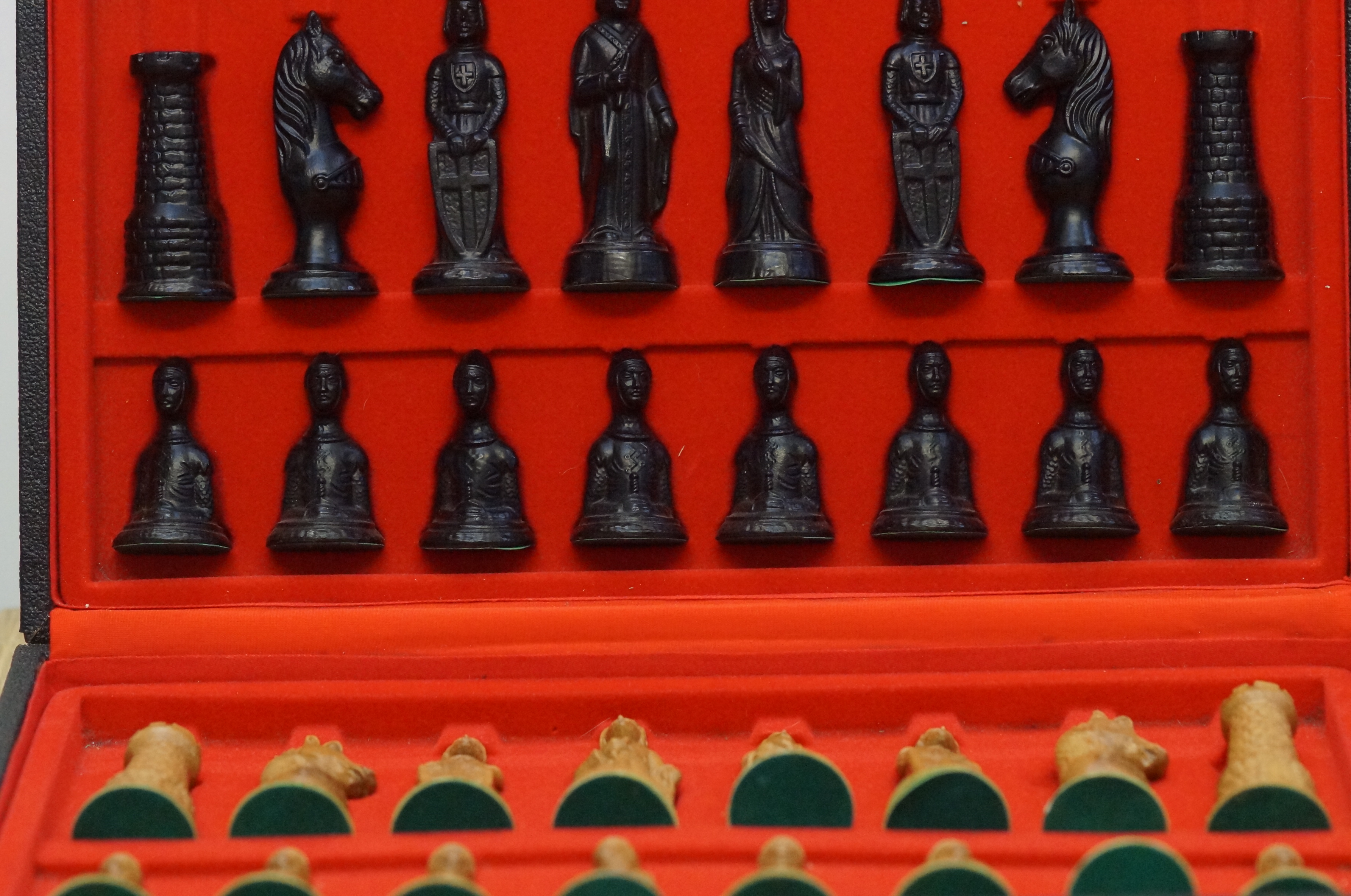 A boxed set of carved resin chest pieces