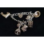 Silver charm bracelet with 7 charms