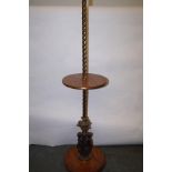 A brass and oak standard lamp, classical figures t