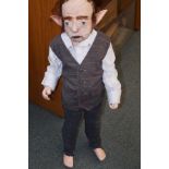 A hand made rubber/latex doll depicting the banker