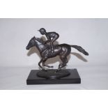 A bronze figure of Lester Piggott titled- Champion