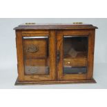 Oak smokers cabinet with original tobacco barrel w