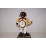 An original ceramic Banjo boy clock 40cm