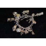 Silver Charm Bracelet. Weight 66g