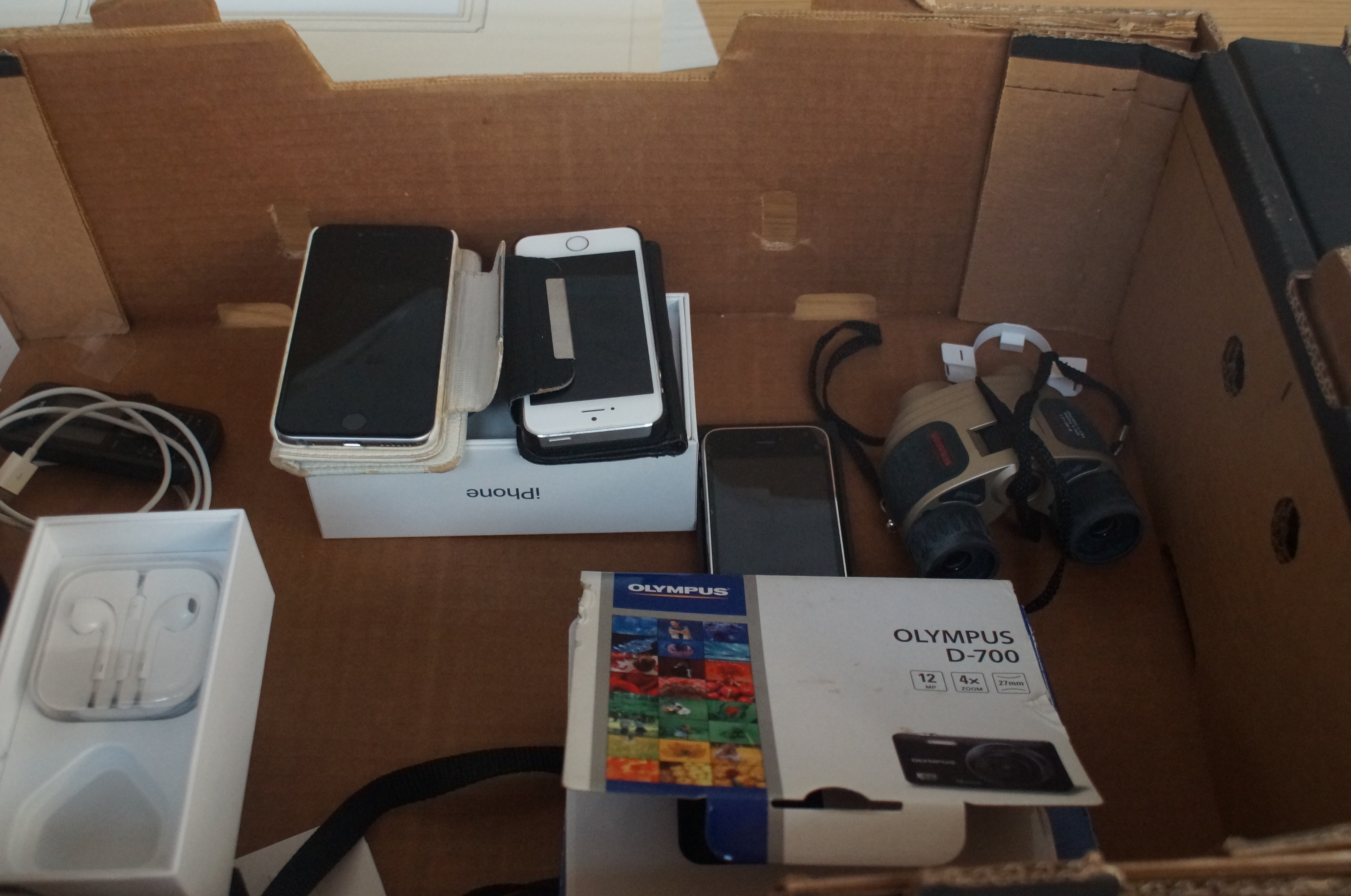 Box to include 3 Iphones, Olympus D-700 Camera and