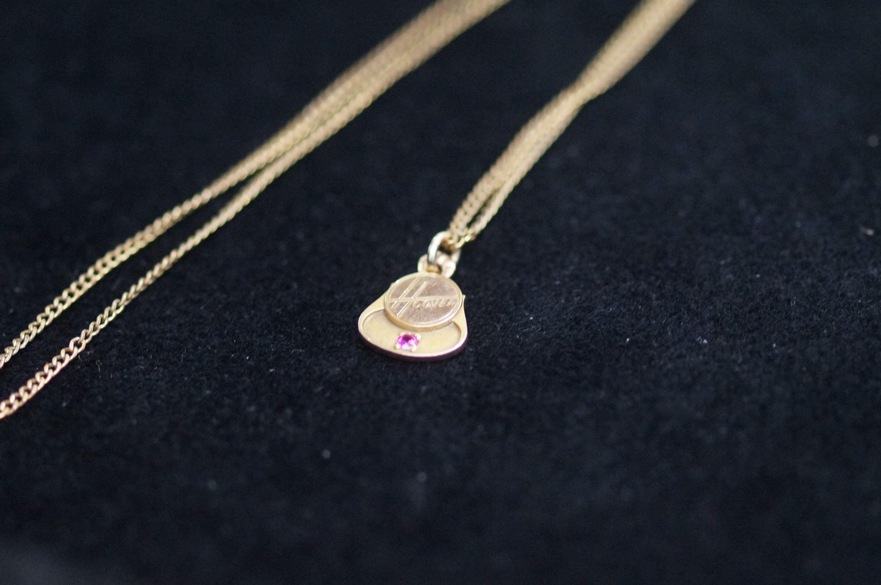 9ct Gold Pendant (Hoover) Suspended on a Gilt Ment