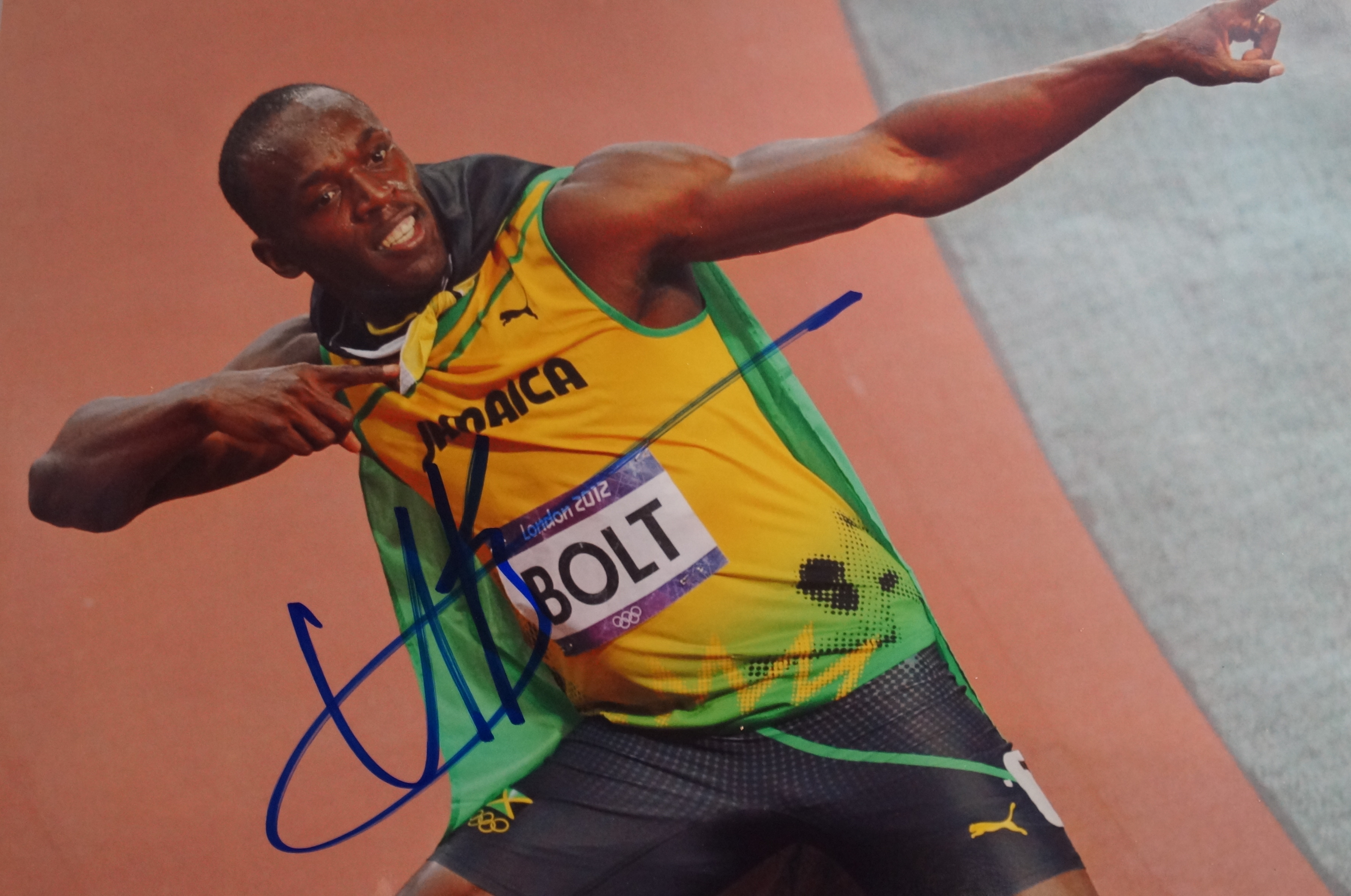 Signed Photograph of Usain Bolt, COA and COA Stamp