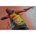 Signed Photograph of Usain Bolt, COA and COA Stamp