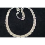 Silver choker necklace with blue box