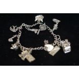 Silver charm bracelet with 11 charms