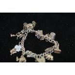 Silver charm bracelet with 13 charms