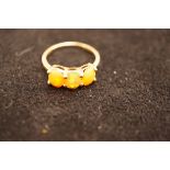 9ct Gold Ring set with orange stones possibly Opal